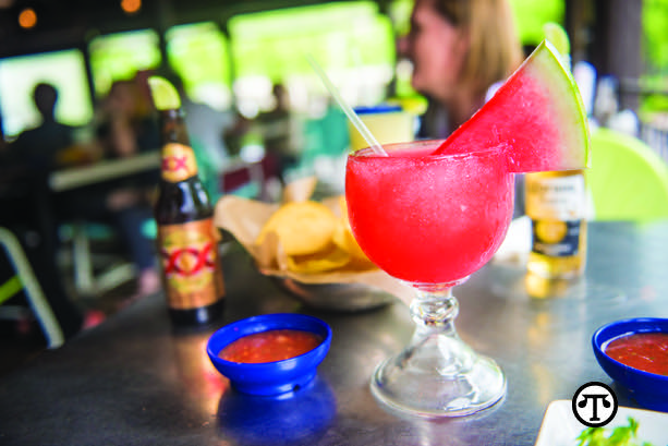 This pretty, pink Watermelon Margarita makes a refreshing accompaniment to relaxing on the patio.