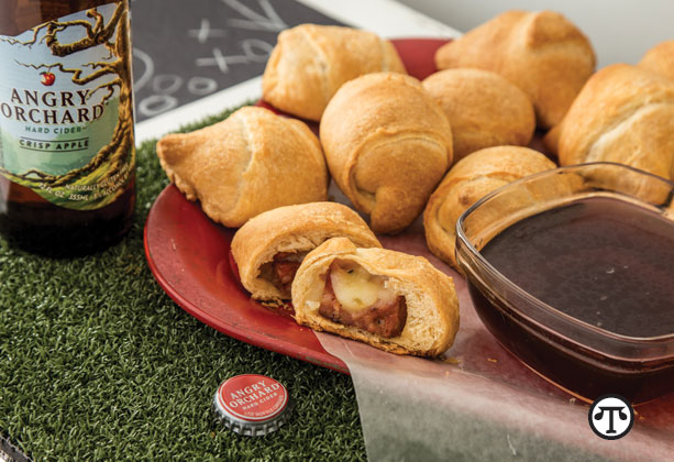 Pepper Jack Pigs in a Blanket with Angry Orchard Dipping Sauce pair well with cider-infused cocktails, great games and good times.