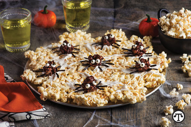 Weave a web of tasty treats for a festive fall party with this popcorn spider web.