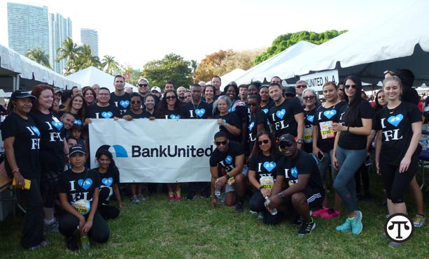 Walking with your co-workers to raise money for a good cause is a great way to reduce your risk of ill health. Here, BankUnited employees get fit at a charity walk.