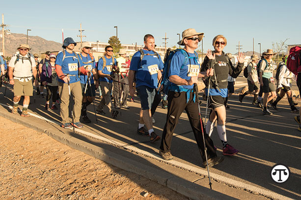 Blind veterans Nate Gorham, Steve Baskis, Lonnie Bedwell, Dan Standage and Tim Hornik walk the 26.2-mile Bataan Memorial Death March challenge.