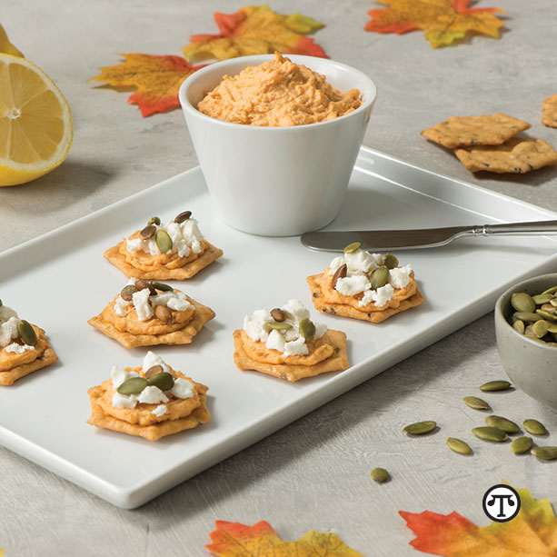 Sweet Potato Hummus and Goat Cheese served with Crunchmaster® crackers make for a tasty snack that’s great anytime and a good way to use up leftover cooked sweet potatoes.